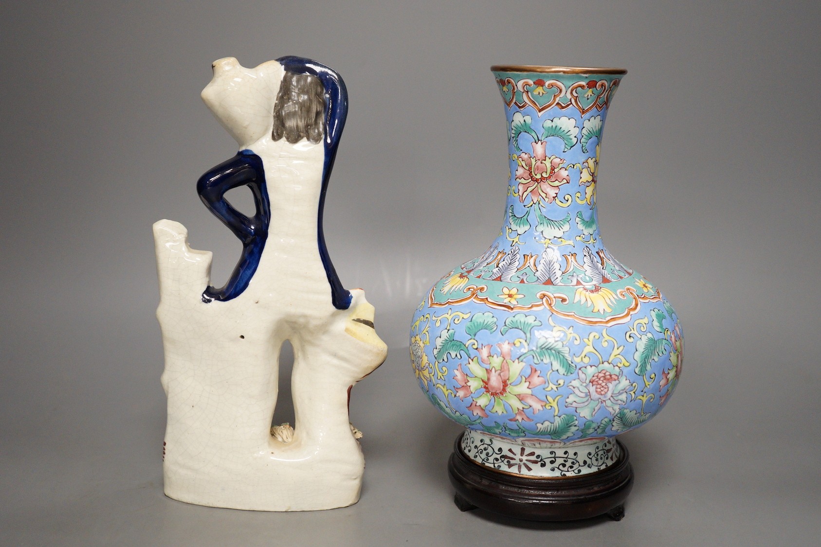 A Chinese canton enamel vase, wood stand, 23.5cm tall